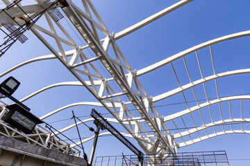 Fototapeta premium industrial steel structure with scaffolding at building site