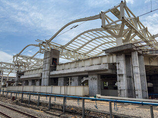 Fototapeta premium construction of railway station roof with steel beams and trusses