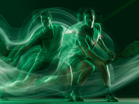 dynamic double-exposure portrait male athlete playing squash in active wear clothes, mid-motion, with overlapping different stances, vibrant green studio lighting,