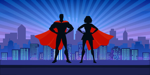 Superhero silhouettes male and female with city skyline background © Mira