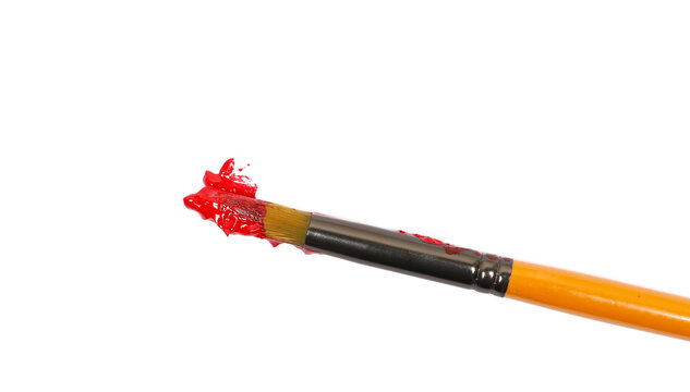 Close up paintbrush and spilled red acrylic paint isolated on white background, design element, top view