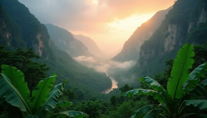 Obraz premium Tropical jungle valley at sunrise. Steep mountain cliffs frame misty forest with river flowing below. Rich banana leaves in foreground create natural depth, serene green landscape.