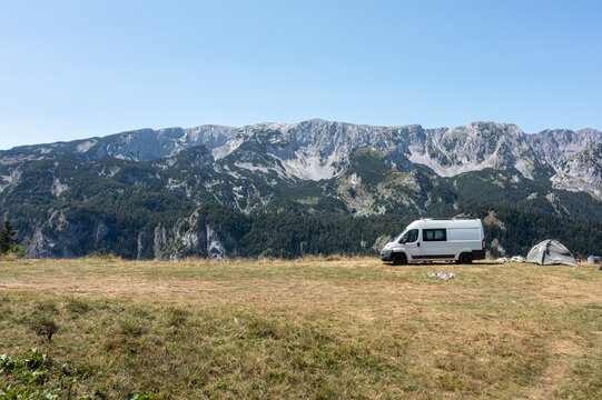 Scenic van camping near mountains with a clear blue sky at daytime during summer at Maglic mountain in Bosnia and Herzegovina
