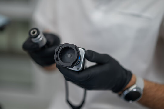 Dentist hands using digital intraoral camera