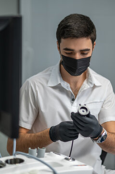 Close up of doctor hands holding endoscopy camera