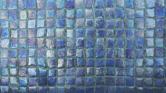 Blue swimming pool bottom with water ripples and light reflections, abstract background texture