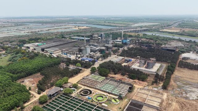 Aerial View Of Distillery Factory Next To Highway