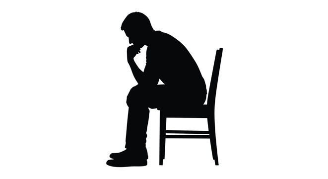Silhouette of a pensive man sitting alone on a chair feeling deep sadness and regret