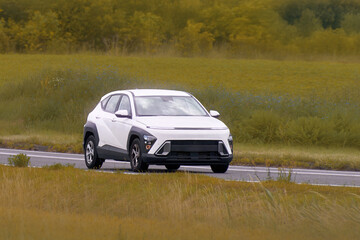Fototapeta premium Eco friendly electric SUV on scenic road