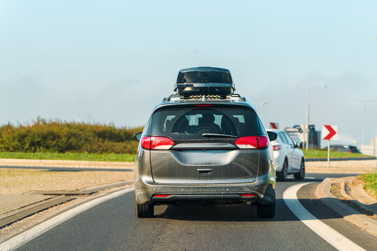 Family car with roof box on summer road trip