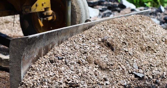 Bulldozer, Loader pushing soil and gravel at a construction site, heavy machinery and infrastructure work outdoors, close-up
