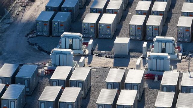 Aerial view on battery energy storage system for renewable power plant. Industrial lithium batteries facility for clean electricity grid management and sustainable technology infrastructure.
