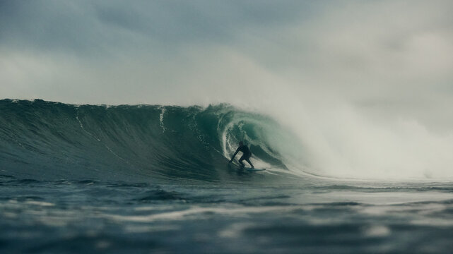 surfer and storm over the sea