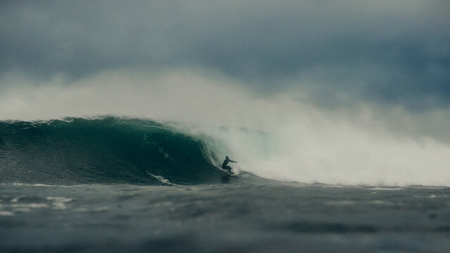 surfer and storm over the sea