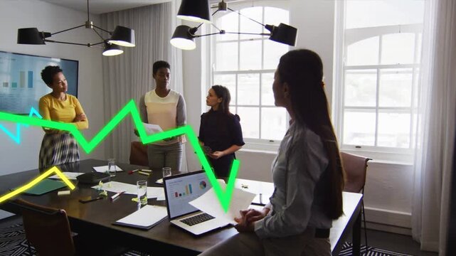 Center presenter starting pitch triggers animated graphs sweeping over laptop in business meeting