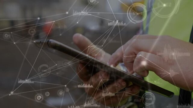 Warehouse worker holding tablet and tapping, initiating node overlay and updating operations data