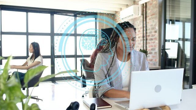 Braided woman typing on office laptop, replying as left peer approaches while HUD overlay centering