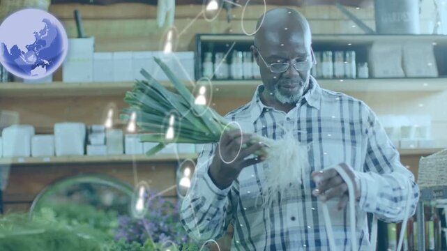 Senior customer shopping, lifting scallions inspecting and tucking into mesh bag as UI animating