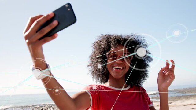 Woman posing and making peace sign, causing tech nodes, lowering phone, tapping, exploring data