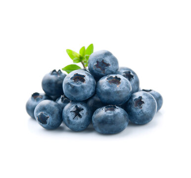 Heap bluberries with twig leaves on white backgrounds