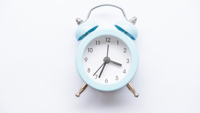 Blue alarm clock on a white background