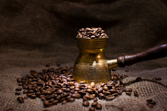 Coffee beans poured into a coffee maker.