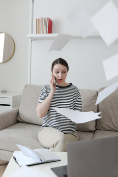 Creative photo of a busy business woman working with documents at workplace in a modern office. office manager or freelancer in a stylish room.