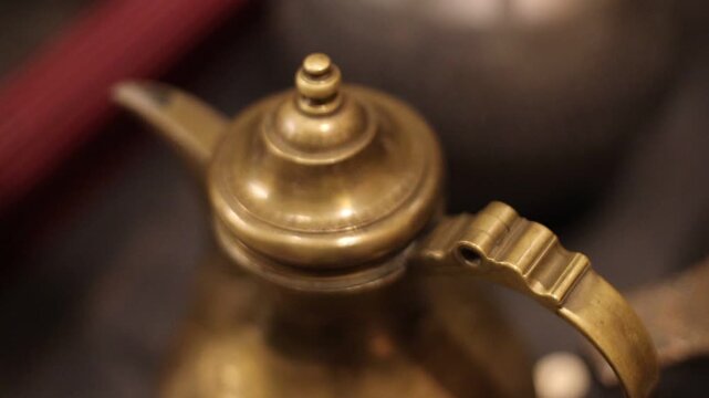 A close-up shot of a teapot on a table