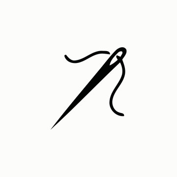 Black sewing needle with thread isolated on white background