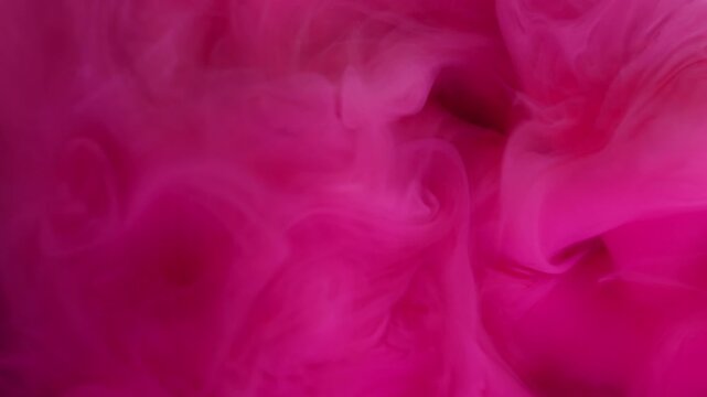 Smoke liquid. Mist ink splash. Defocused pink vibrant color cloud glitter underwater acrylic fume spreading on abstract background.
