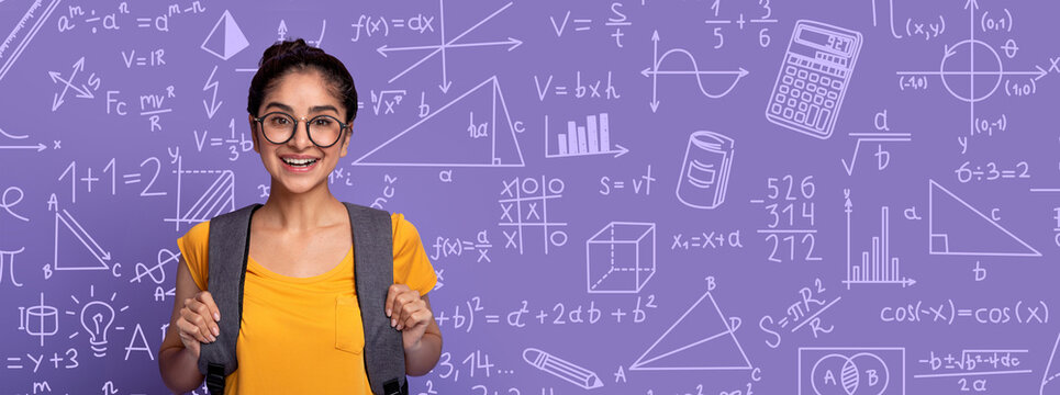 A student stands in front of a purple backdrop filled with math symbols and equations. She smiles while holding her backpack, showing enthusiasm for learning and discovery.