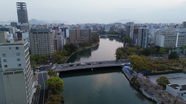 Hiroshima cityscape with river and bridge aerial at sunset