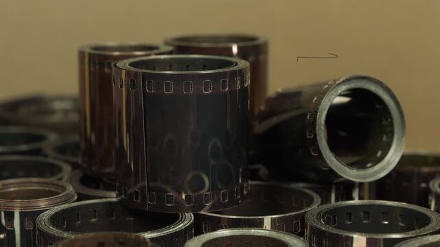 Old photographic films. Old camera film for retro photo shoots. Vintage film rolls for classic photography. Developed retro film rolls from analog cameras