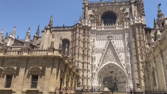 Seville Cathedral exterior with detailed gothic architecture and historic stone facade in Spain