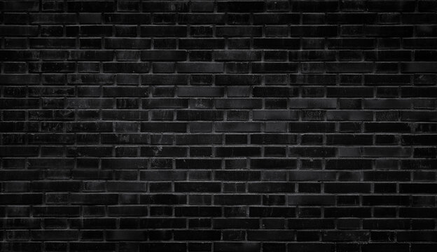 Black Brick Wall Background Texture. Dark black brick wall texture with natural masonry pattern. Industrial brick background for interior design, architecture, construction, urban style, wallpaper