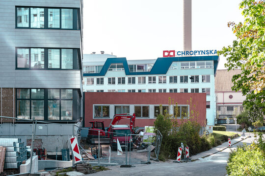 Olomouc, Czech Republic - April 25, 2026: Urban construction site with excavator and industrial buildings in Olomouc Czech Republic