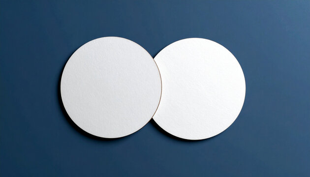 Two blank white round beverage coasters mockup. Top view of circular paper beer mats for branding design presentation. Stationery mockup for bar, restaurant, or cafe corporate identity.