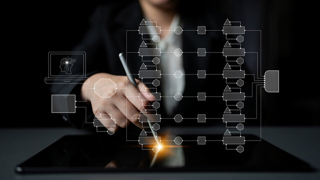 Business Professional Using Digital Tablet for Workflow Visualization and Data Analysis in Modern Office Environment with Flowchart Graphics Quark.