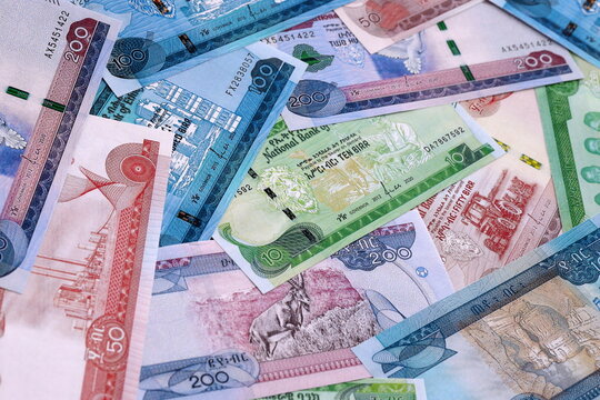 Ethiopian birr money bills pile on table. Ethiopia banknotes of ETB currency close up.