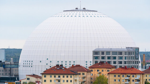 Stockholm, Sweden - 2026.05.03: Stockholm residentual housing with the The Avicii Arena (previously Globen Arena) covering a huge part of the background. Architecture and Stockholm content.