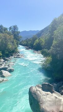 Hornopir&eacute;n, Chile - March 20, 2026: The Blanco River flows through the lush nature of Chilean Patagonia. Its turquoise waters originate from glaciers.