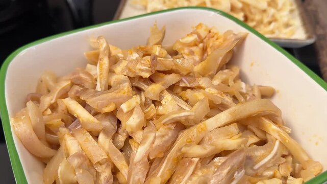 Pig ear food, appetizer for beer, served with soy sauce, loop, 4K, ProRes codec, 422 HQ