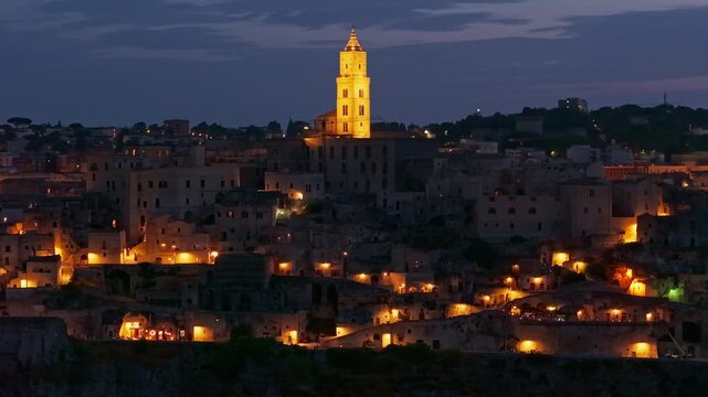 Aerial night view of the illuminated Sassi di Matera, Basilicata, Italy