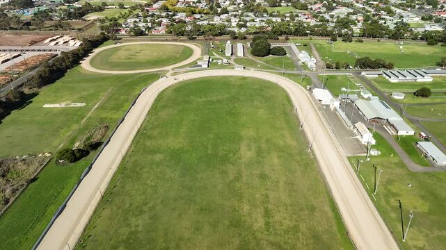 Mount Gambier Showgrounds, South Australia: 4K aerial drone footage of event grounds, oval track, open field and surrounding suburb near Umpherston Cave