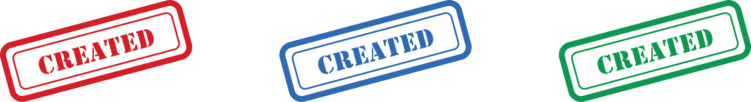 A trio of vibrant rectangular stamps with the word CREATED clearly displayed on a white surface