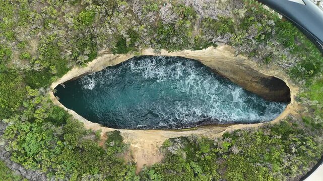 Poombeeyt Koontapool lookout, Great Ocean Road, Port Campbell, Victoria, Australia: 4K aerial drone footage of coastal blowhole, limestone cliffs, ocean waves, coastline. 