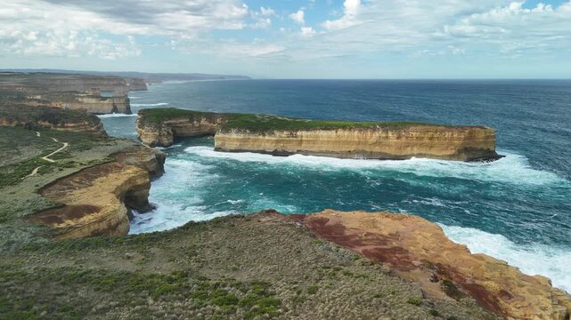 Thunder Cave and Mutton Bird Island, Great Ocean Road, Port Campbell, Victoria, Australia: 4K aerial drone footage of sea cave, cliffs and ocean waves