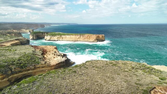 Mutton Bird Island, Great Ocean Road, Port Campbell, Victoria, Australia: 4K aerial drone footage of sea cave, cliffs, coastline and ocean waves near Thunder Cave