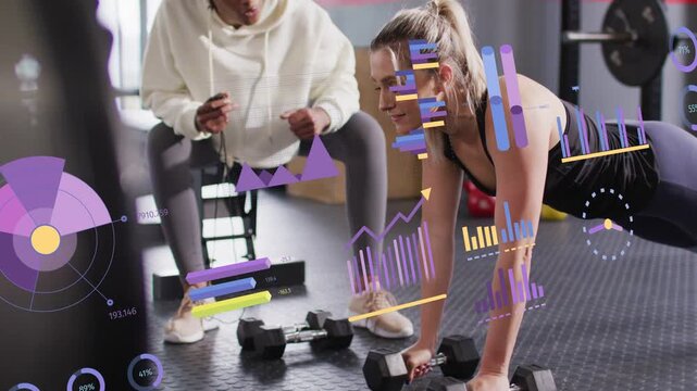 Coach tapping device cueing reps while woman in plank doing single-arm rows HUD tracking fitness