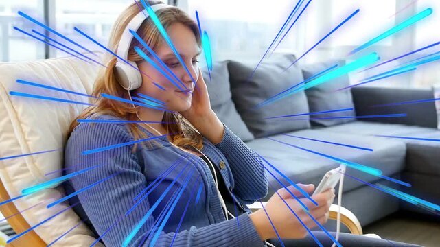 Woman tapping phone and adjusting headphones in chair, streaks visualizing audio while relaxing